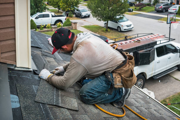 Professional Roof Replacement technician working in Rockville Centre, NY